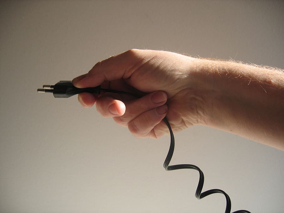 person holding black 2-prong adapter, energy, hand, current HD wallpaper