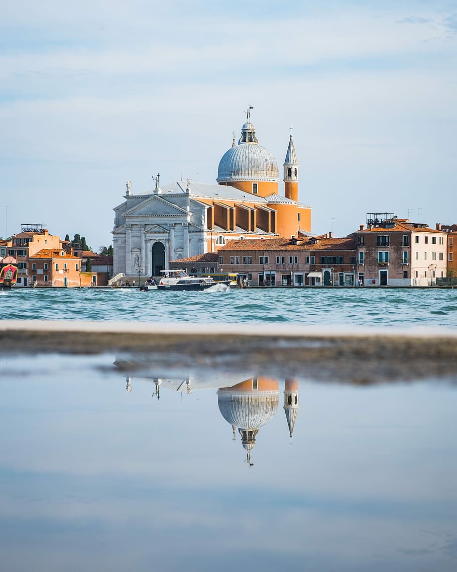 landscape photography of brown and gray mosque, reflective photography of cathedral near body of water HD wallpaper