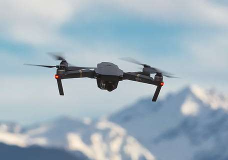 black drone quadcopter on air, selective focus photography of DJI Mavic drone HD wallpaper