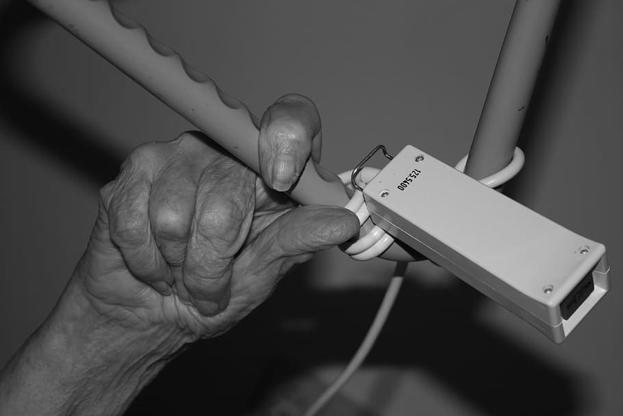 persons hand on gray metal bar, old, woman, fold, bell, klingelkonpf