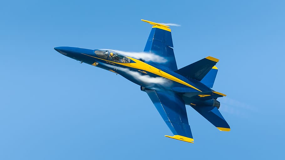 blue and yellow fighter jet plane flying in the sky, blue angels