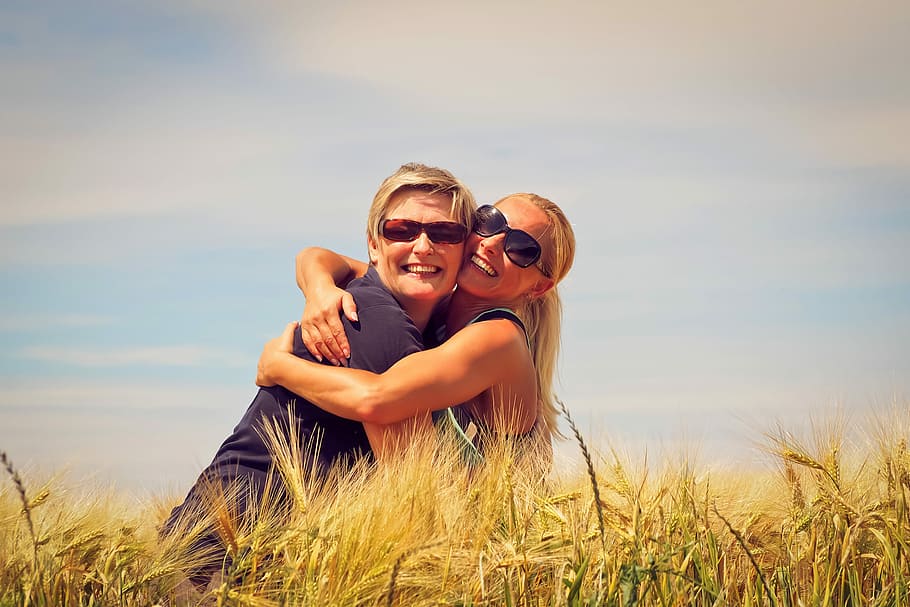 two women hugging beside brown grasses during daytime, Embrace, HD wallpaper