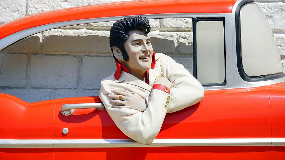 Elvis Presley inside red car, automobile, automotive, bel air