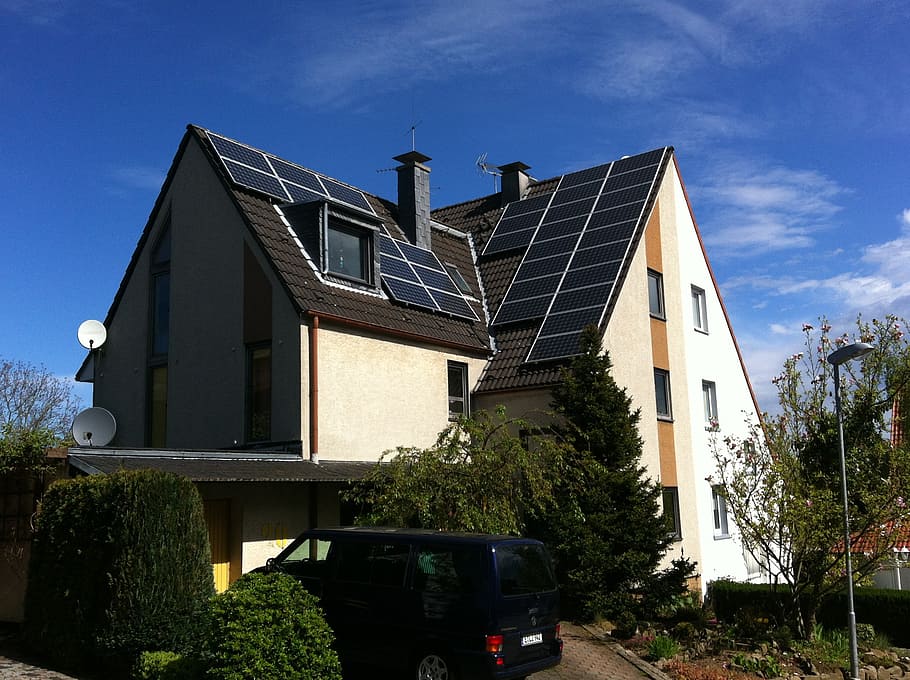 white and black house during daytime, photovoltaic, renewable energy
