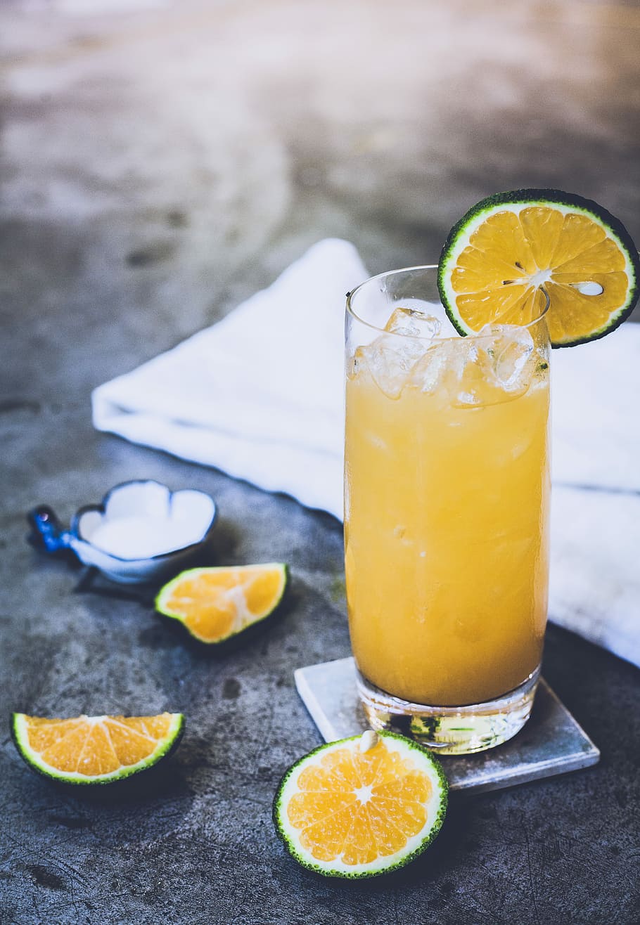 citrus juice on glass near towel, lemon juice glass on table HD wallpaper