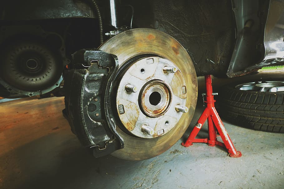 red vehicle stand under black vehicle, brake, disk, disc brake HD wallpaper