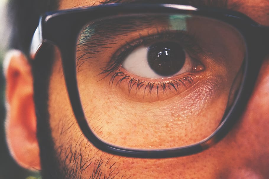 Closeup shot of a man’s eye and glasses, people, face, fashion