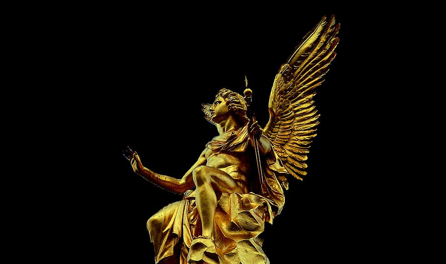 bottom view of gold-colored angel statue, christmas angel, advent