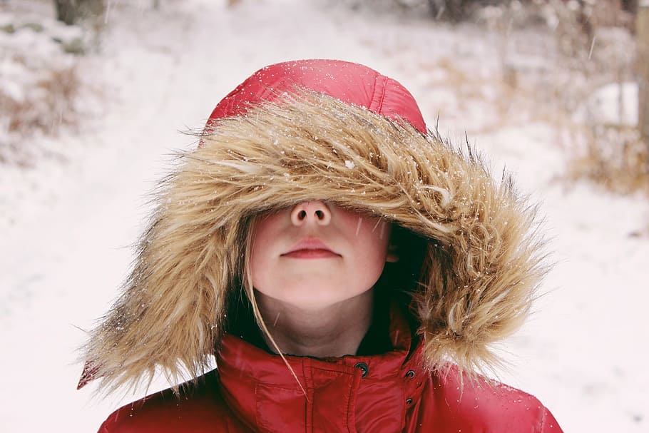 woman wearing beige and red hoodie, girl wearing red hooded winter jacket while standing on snow field HD wallpaper