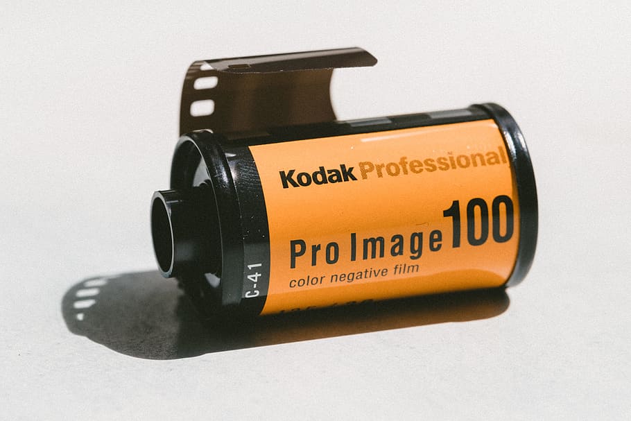 yellow and black Kodak Pro Image 100 color negative film, brown and black Kodak Professional color negative film HD wallpaper