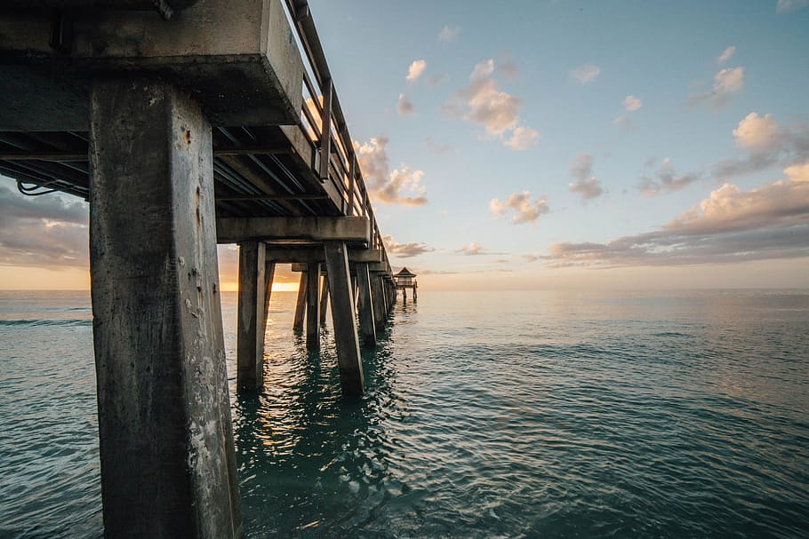 sea, ocean, water, waves, nature, wooden, bridge, clouds, sky HD wallpaper