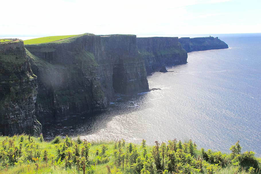 aerial photography of green mountain near body of water, cliffs of moher