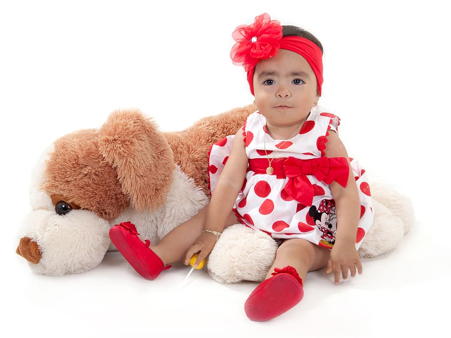 baby wearing white and red polka-dot dress beside dog plush toy, HD wallpaper