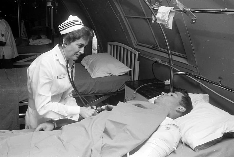 Nurse Treating Soldier in Hospital during the Vietnam War, photos