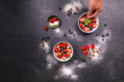 two round white and one brown bowls with strawberries and blue berries HD wallpaper