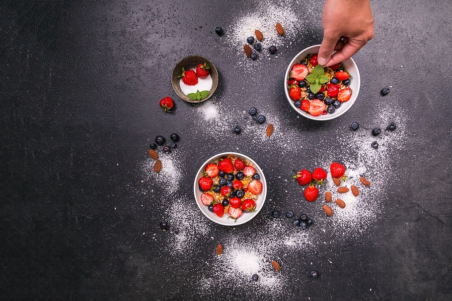 two round white and one brown bowls with strawberries and blue berries HD wallpaper