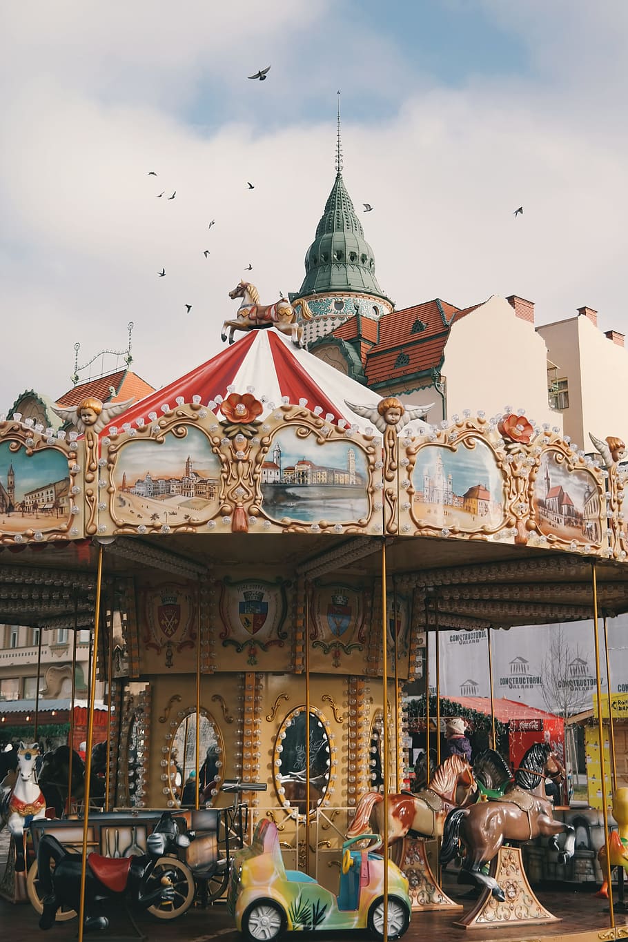 carousel ride under bright sky, group of birds flying over carousel HD wallpaper