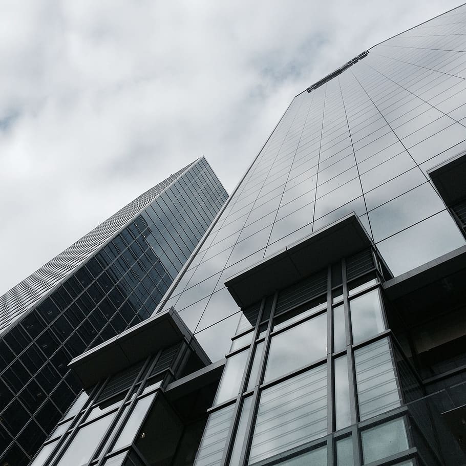 bottom view of high rise building under cloudy sky, perspective HD wallpaper