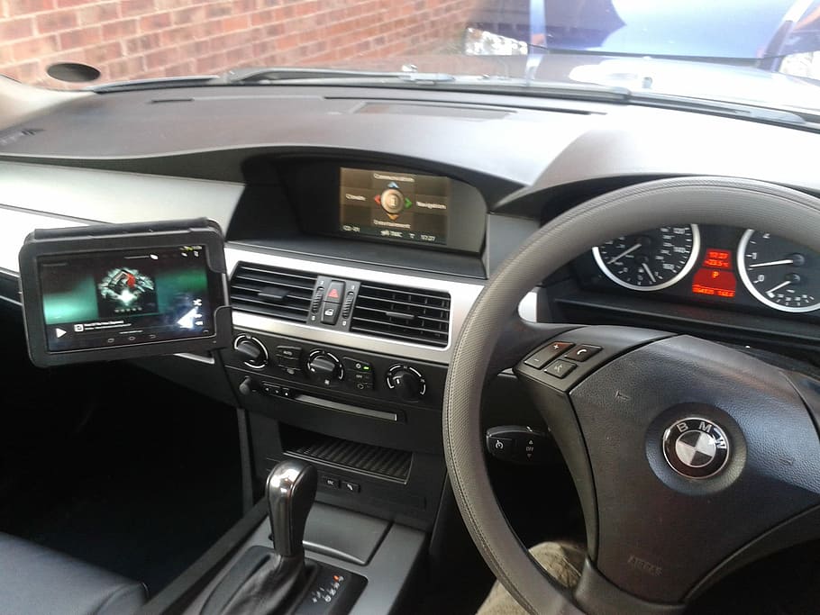 BMW vehicle parked beside brick wall, Cockpit, Steering, Dashboard HD wallpaper