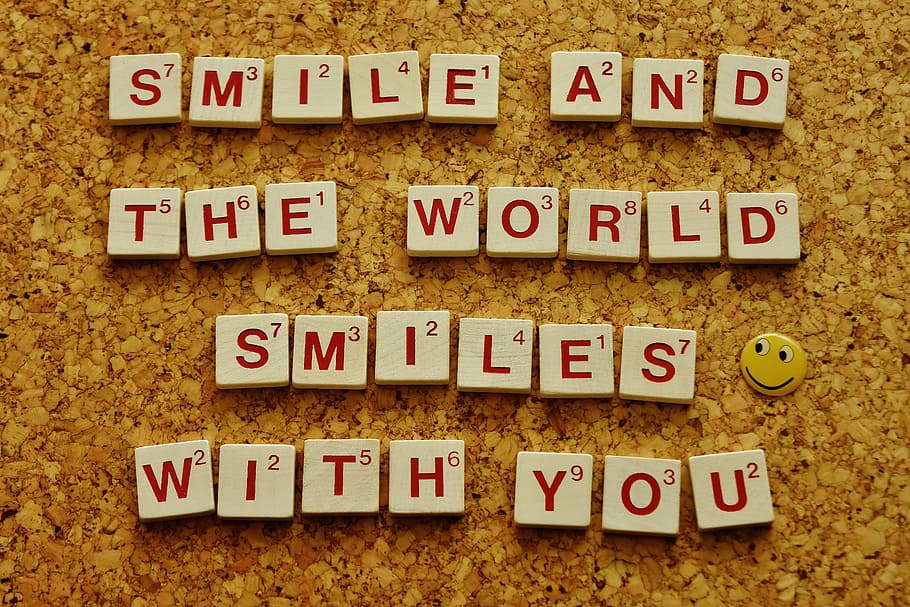 smile and the world smiles with you scrabble piece saying, cheerful