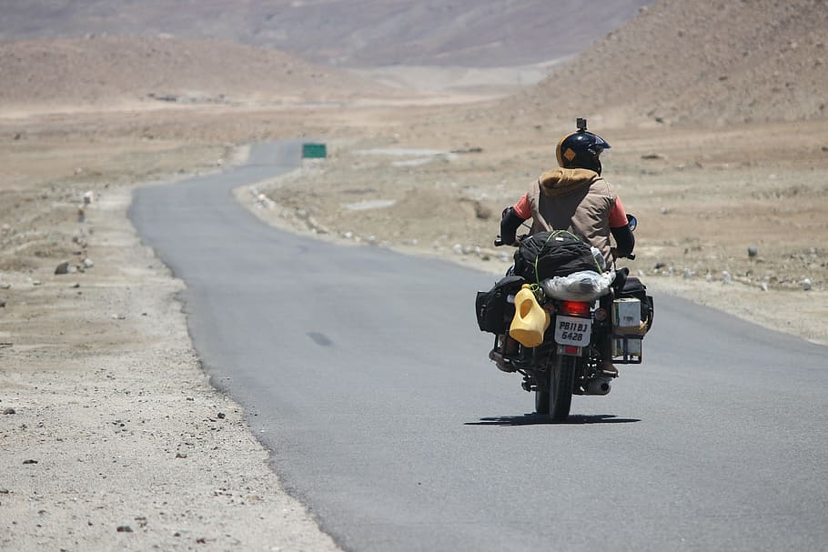 person driving motorcycle at road, rider, himalyan, bullet HD wallpaper