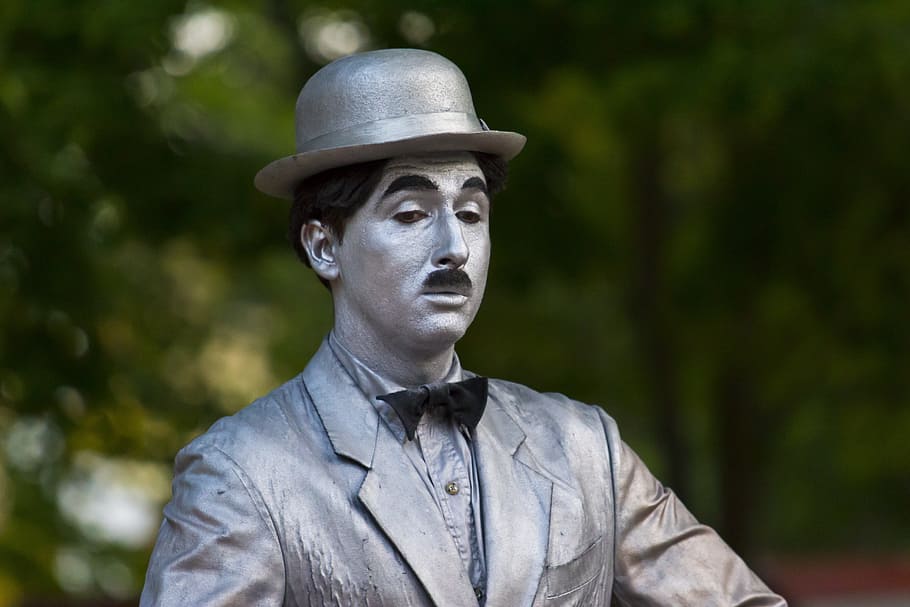 male statue wearing bowler cap selective focus photography, Charlie Chaplin