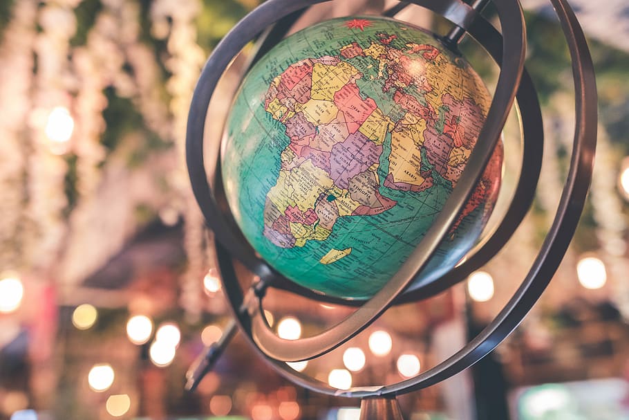 close-up photo of earth globe, macro photography of world globe HD wallpaper
