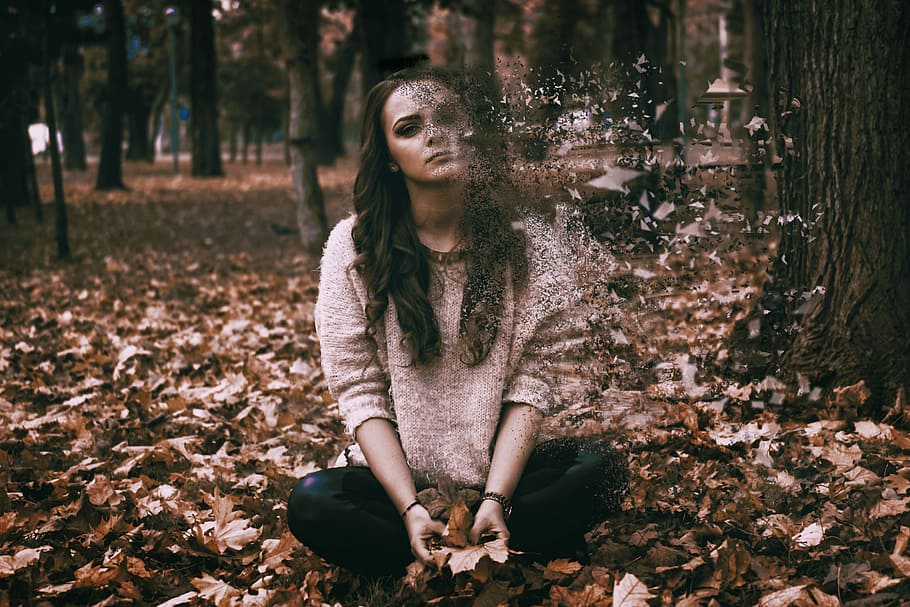woman sitting on dried leaf, sadness, depressed, girl, alone
