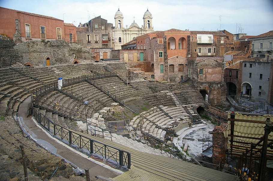 The Church of Saint Francis of Assisi backs the Cavea of the Greek-Roman Theatre in Catania, Italy