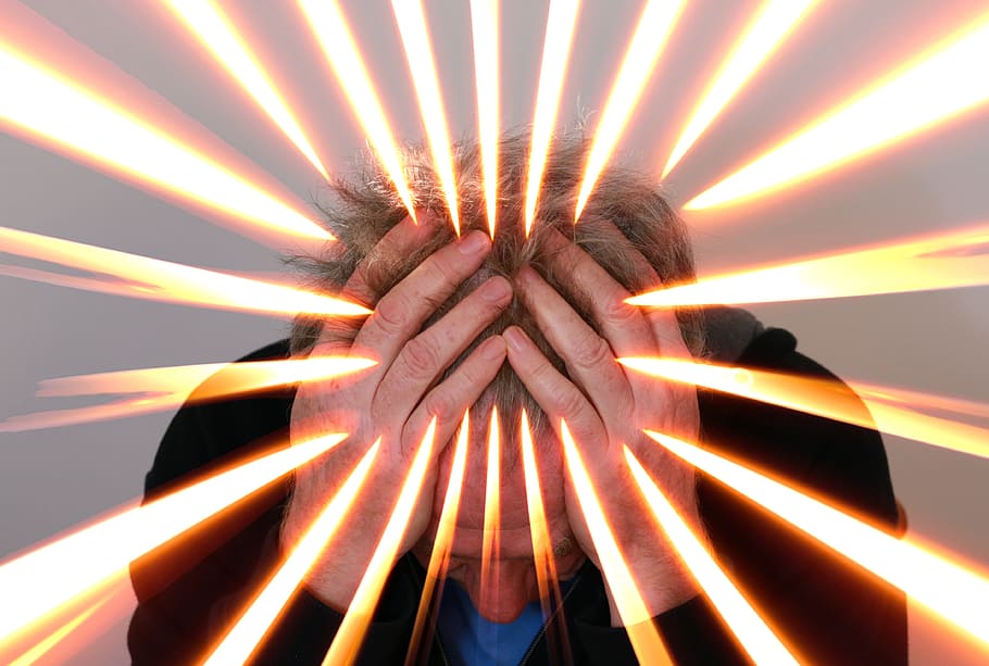 man in black jacket holding his head, stress, hand, flame, burn