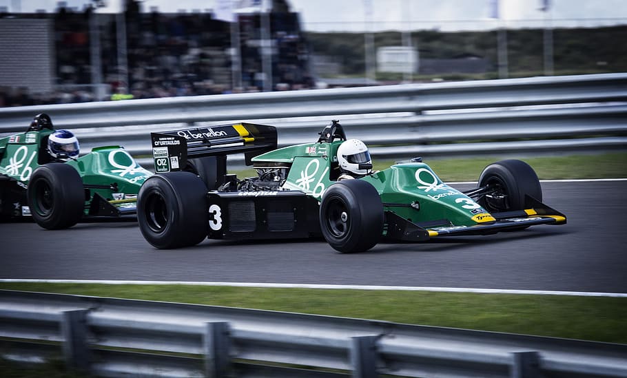two green F1 cars racing on track, fast, speed, speedway, racing car HD wallpaper