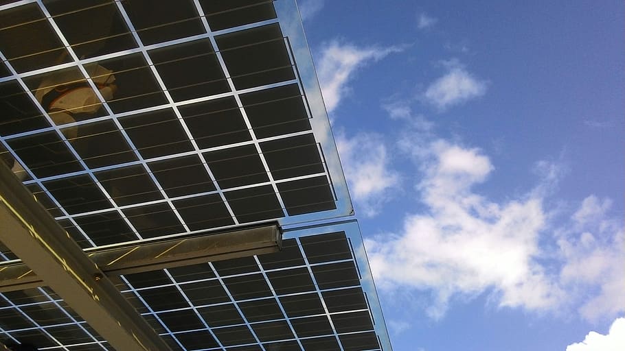worm's-eye view photography of solar panel under cloudy sky HD wallpaper