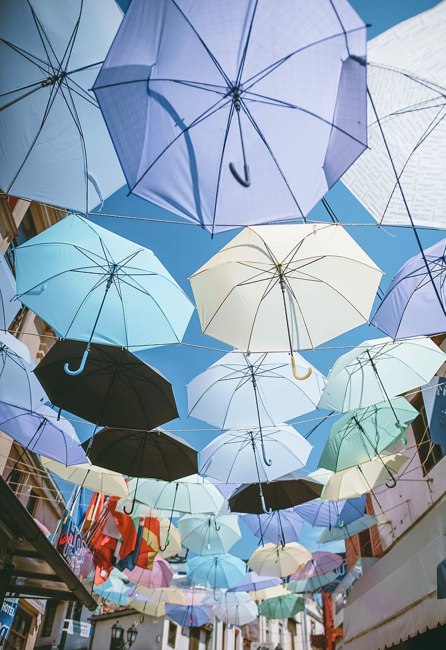 assorted-color umbrellas hanged on wires under blue sky during daytime, photo of umbrella roof during daytime, HD wallpaper