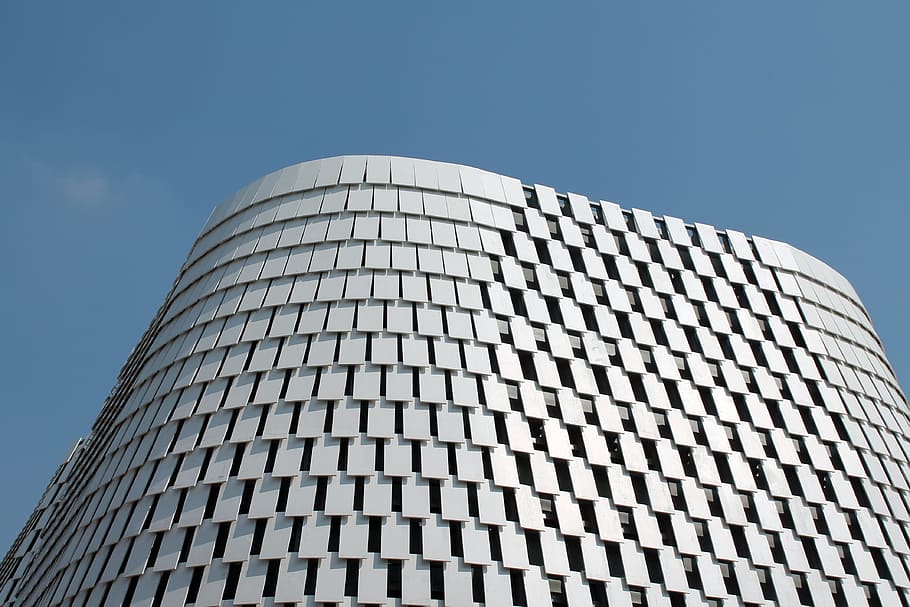 low angle photography of high-rise building, white concrete high-rise building under blue sky HD wallpaper