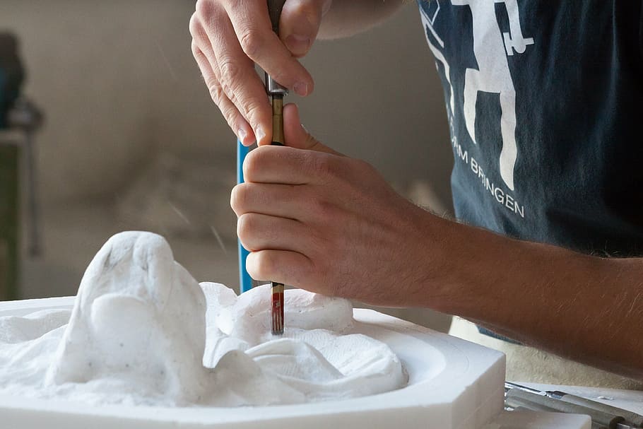 person molding a sculpture, sculptor, steinmetz, arts crafts
