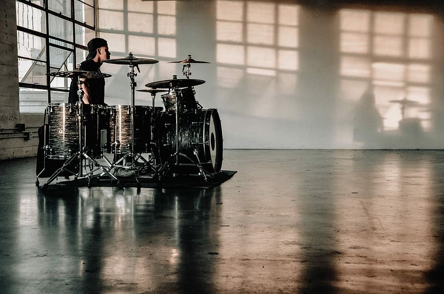person in front of drumset, man's playing drum instrument, warehouse HD wallpaper