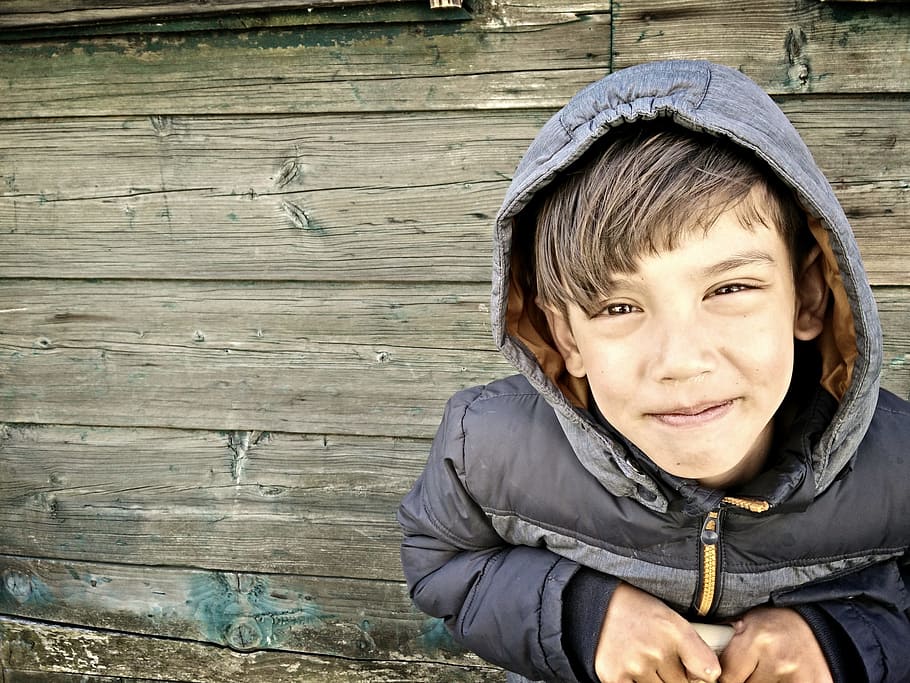 boy smiling while sitting near wall, hdr, close up, people HD wallpaper