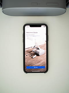 iPhone displaying Welcome to Oculus, black smartphone beside gray speaker HD wallpaper