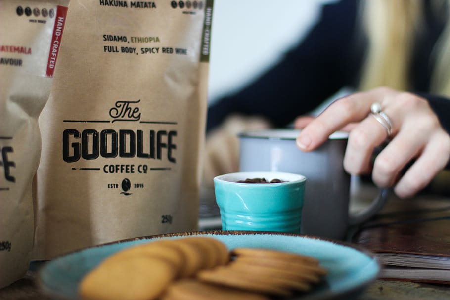 plate full of biscuits and bag of coffee, tilt shift photography of Th Goodlife Coffee pack HD wallpaper