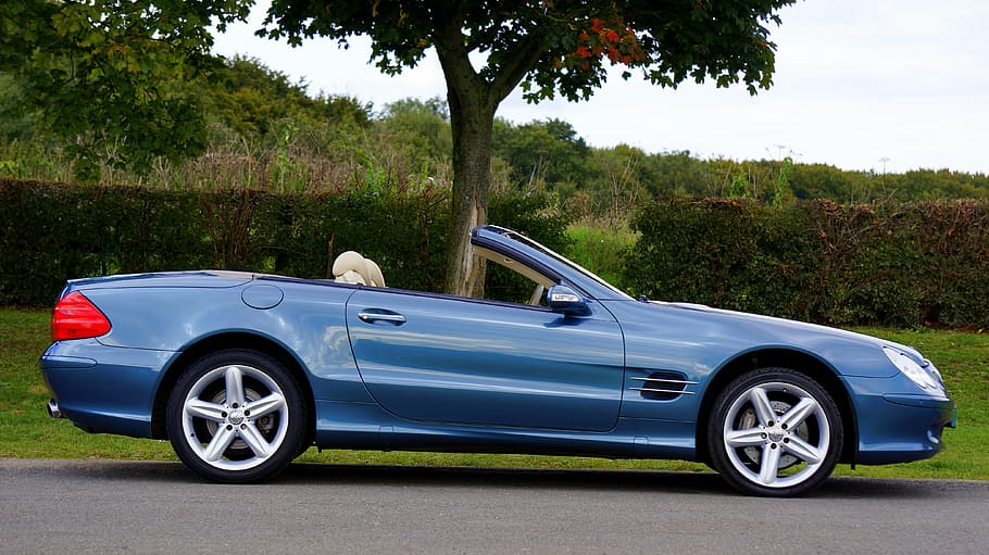 blue Mercedes-Benz convertible coupe parked near green leaf tree HD wallpaper