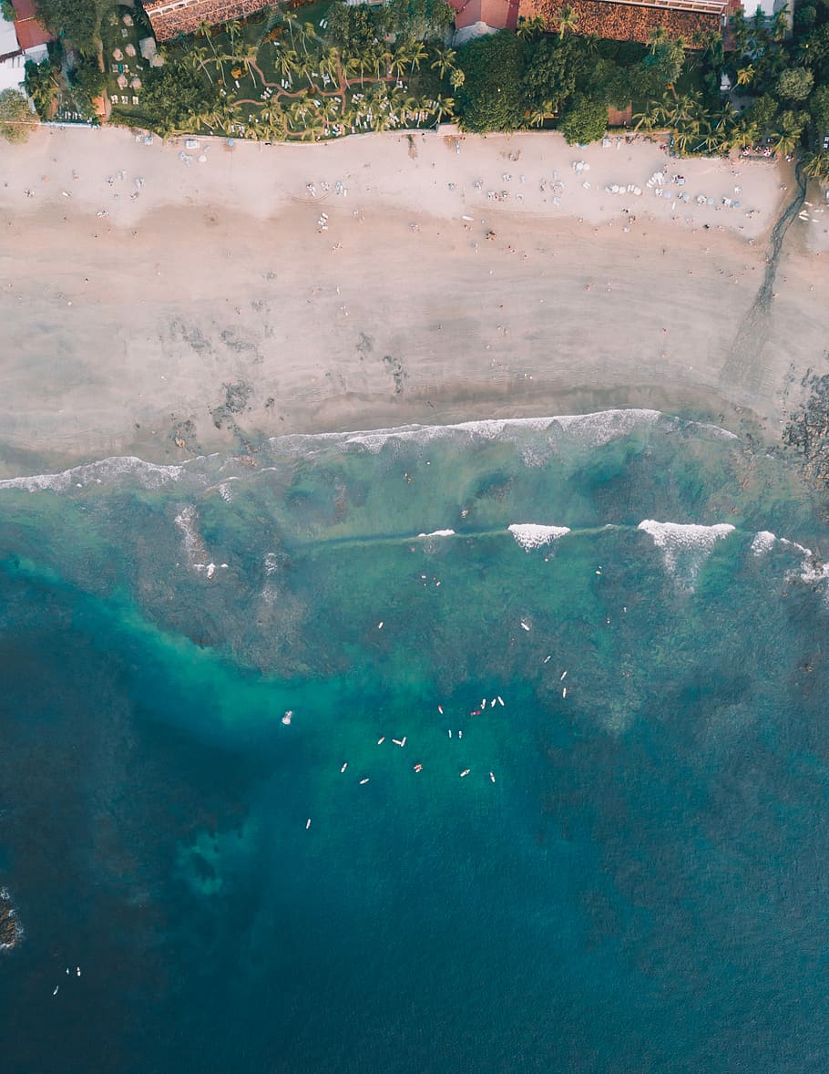 beach near building top-view photography, aerial view on body of water beside houses HD wallpaper