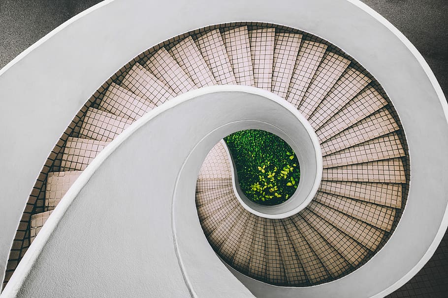 white and brown concrete spiral stairs, aerial photography of white staircase