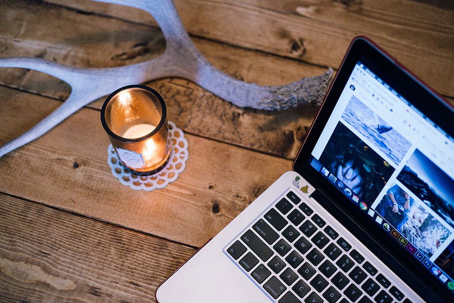 silver MacBook Pro, antler, candle, computer, laptop, screen HD wallpaper
