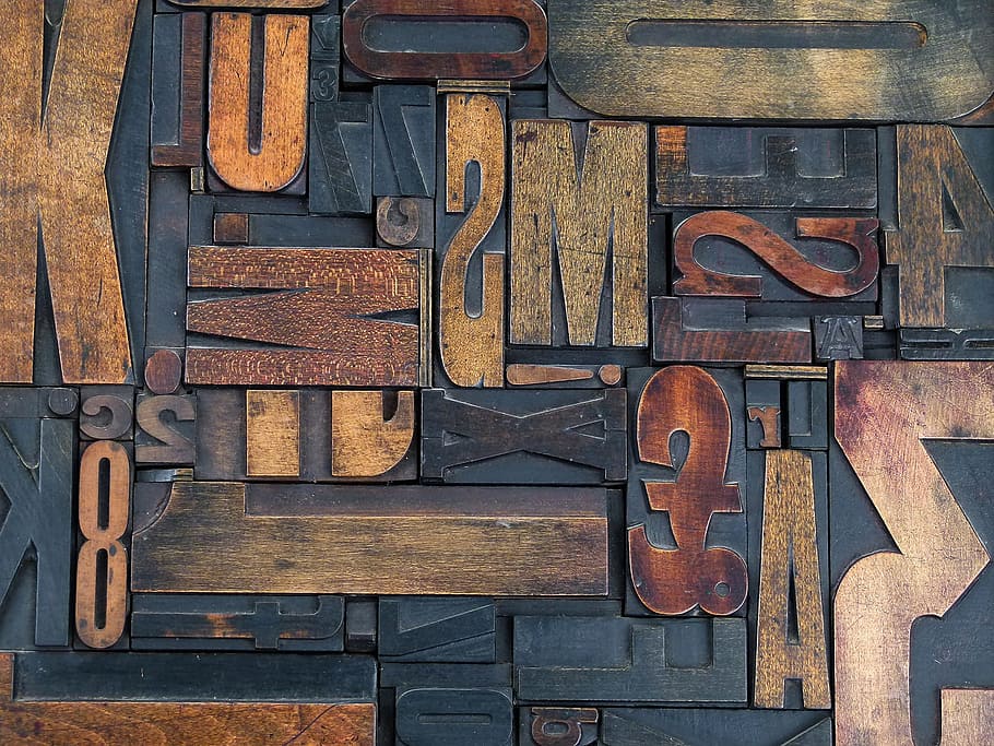 closeup of numbers and letters wood carvings, wooden, old, artwork