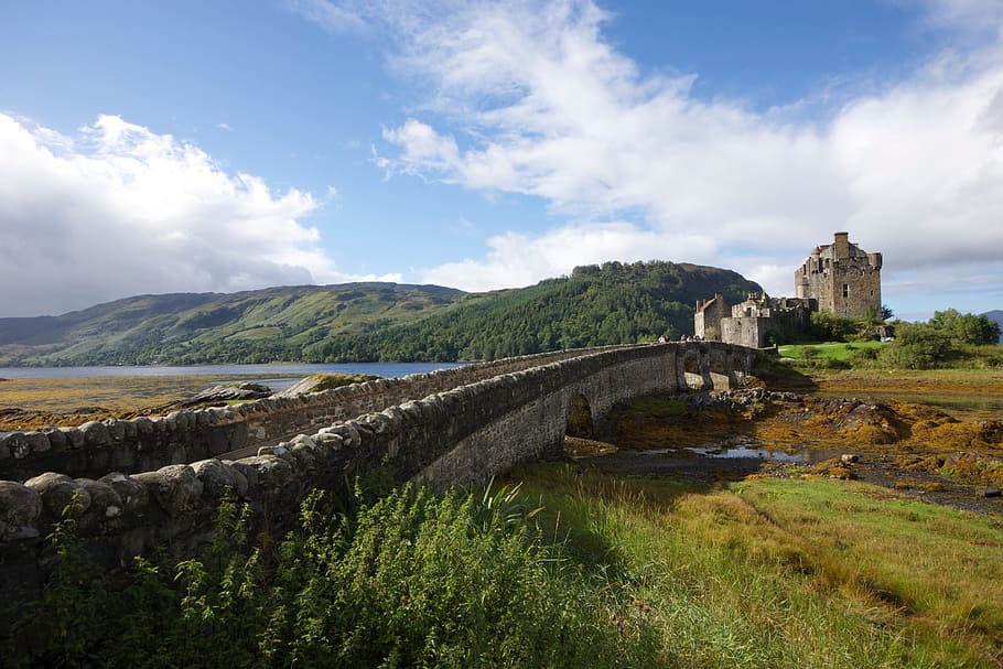 photo of concrete bridge near mountain range and tower, ancient HD wallpaper