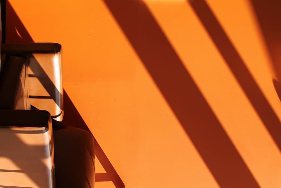 minimalist photography of orange painted wall with shadows HD wallpaper
