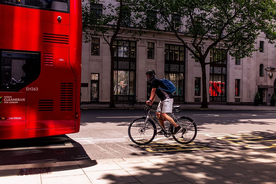 person riding bicycle on street during daytime, man rides gray bike, HD wallpaper