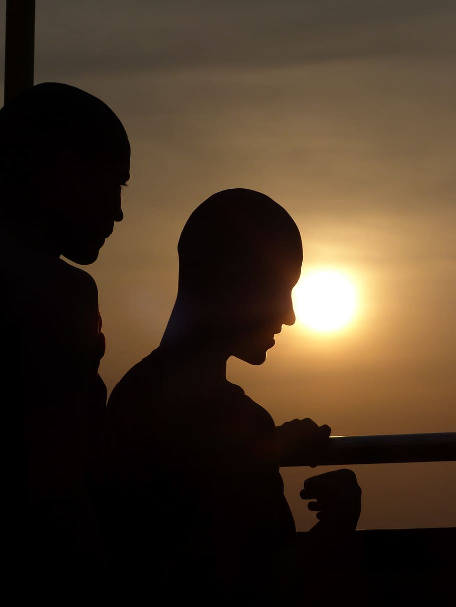 silhouette, backlit, people, sunset, man, two people, sky, real people HD wallpaper