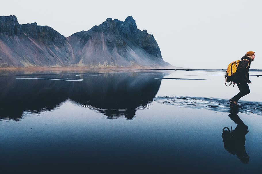 person standing on body of water, human walking on body of water during day time HD wallpaper