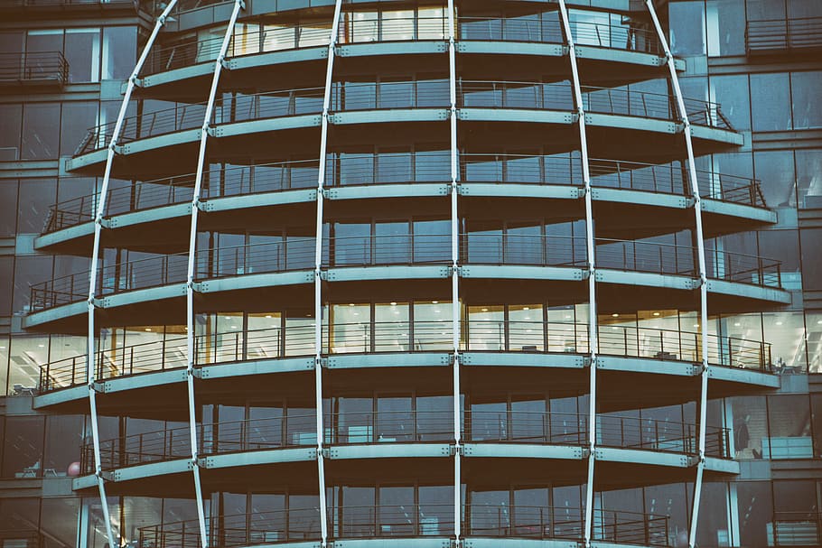 Wide-angle shot of glass windows on a building on The Thames river in London, England HD wallpaper